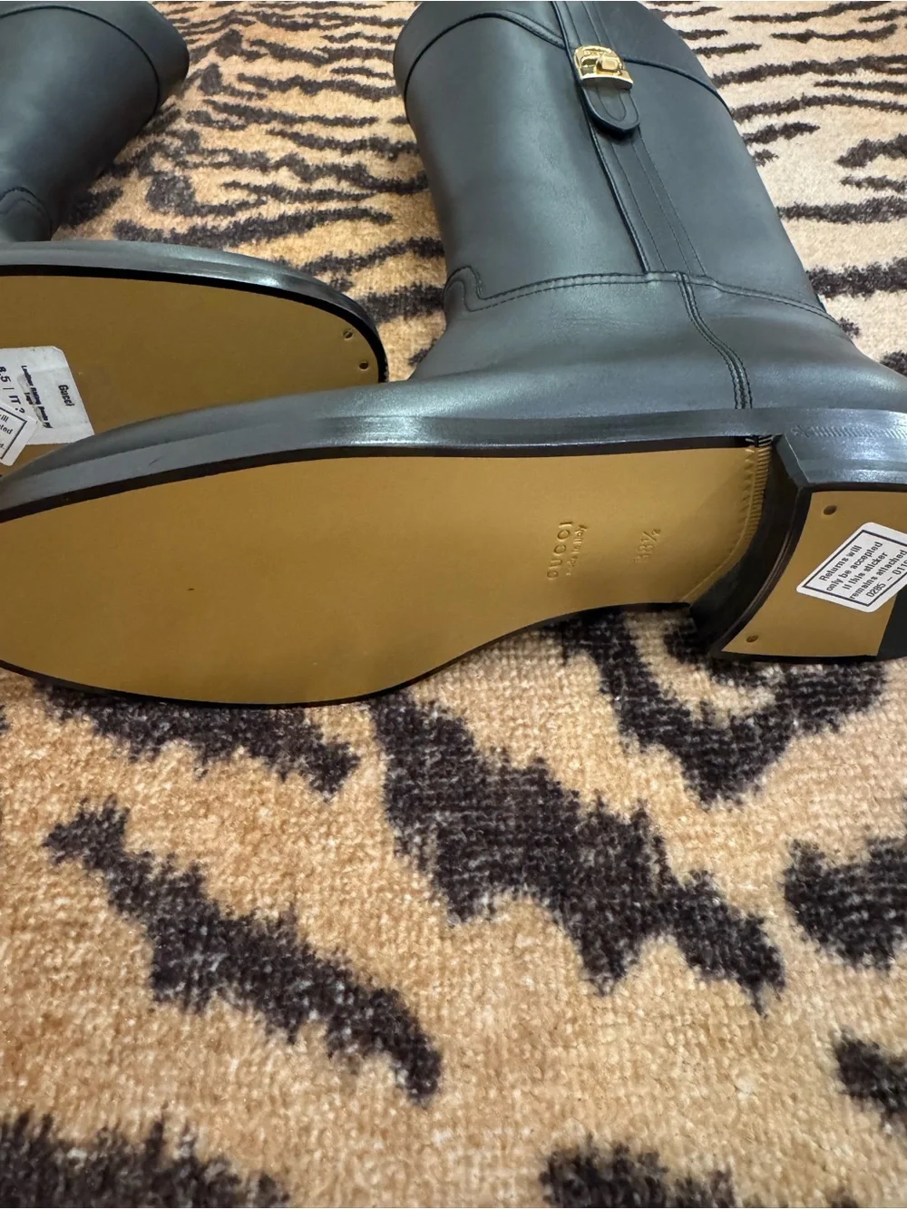 GUCCI Women’s Black Leather Knee-High Riding Boots with Gold Buckle